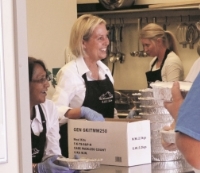 woman handing out food